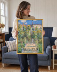 Lifestyle: living room — A white-clapboard New England Cape Cod, mid-20th-century, with beadboard panelling, painted navy wainscot and wide-plank pine floors — quiet, considered and coastal in spirit.