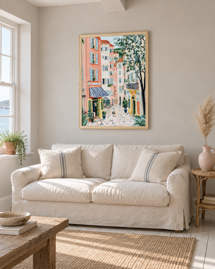 Lifestyle: living room — A whitewashed Cornish coastal cottage with painted timber floors, generous sash windows and simple plaster walls — warm, unhurried and slightly sun-bleached