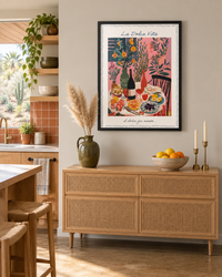 Lifestyle: kitchen — A 1960s Phoenix mid-century single-storey home with clean horizontal lines, low ceilings, and wide picture windows facing a desert garden — owner-occupied, late-30s couple celebrating an anniversary.