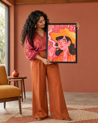 Lifestyle: living room — A 1950s LA mid-century house with walnut-panelled walls, terrazzo floors, and clean geometric lines — now updated with warm colour and statement art
