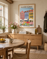 Lifestyle: dining room — Norfolk flint cottage on the North Norfolk coast, early 20th century, thick flint-and-brick walls, pantile roof, generous kitchen-diner opening onto a walled garden.