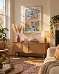Lifestyle: living room — A first-floor Victorian conversion flat in Peckham, south London — one large reception room with original fireplace, tall sash windows, and chalky off-white plaster walls that catch warm afternoon light.