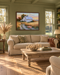 Lifestyle: living room — A cedar-shingle Hamptons house with white trim, wide plank floors and a wraparound porch, painted throughout in a single warm pistachio.