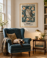 Lifestyle: bedroom — An upstate New York Greek Revival bedroom, white-columned exterior, wide-plank pine floors within, tall windows and restrained classical mouldings — layered with English country antiques by a collector.
