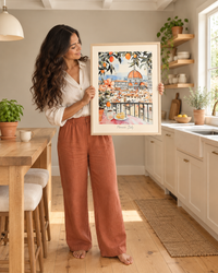 Lifestyle: kitchen — A warm Texas Hill Country home with limestone walls, wide-board pine floors and generous open kitchen with open shelving and simple cream cabinetry