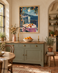 Lifestyle: kitchen — A 1920s Santa Barbara Spanish Revival home — white stucco walls, red tile roof, arched doorways, original terracotta floor tiles, generous kitchen with warm plaster walls and open shelving in painted timber.