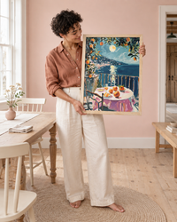 Lifestyle: dining room — A restored Maine white-clapboard farmhouse, early 19th century — wide-plank floors, a dining room with a connected barn glimpsed beyond, simple painted millwork in off-white, used by a couple in their 30s as a year-round home with a love of Italian travel.