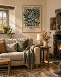 Lifestyle: living room — A Lake District slate cottage, thick rubble-stone walls, low ceilings, casement windows with deep sills looking out to fell grassland, flagstone hall leading to a warm sitting room.