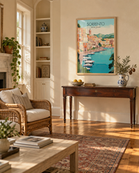 Lifestyle: living room — Antebellum single house on a shaded Charleston street — tall rooms, wide heart-pine floors, side-piazza light, plaster walls in aged cream.