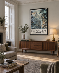 Lifestyle: living room — A tall Georgian townhouse in Bath — symmetrical rooms with original cornicing, panelled shutters, wide-plank oak floors and chalky off-white walls washed in cool northern light.